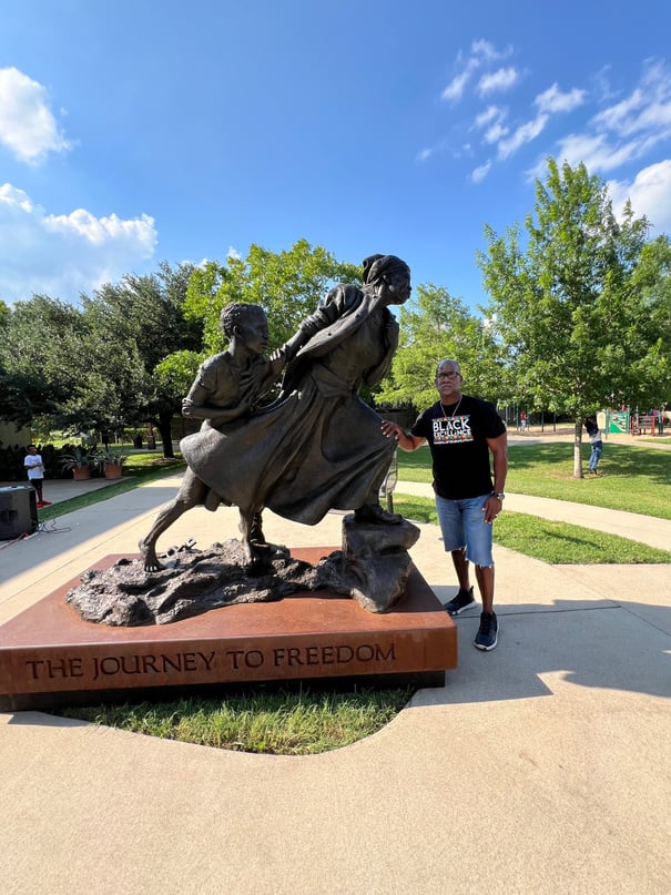 Person in front of Harriet Tubman statue