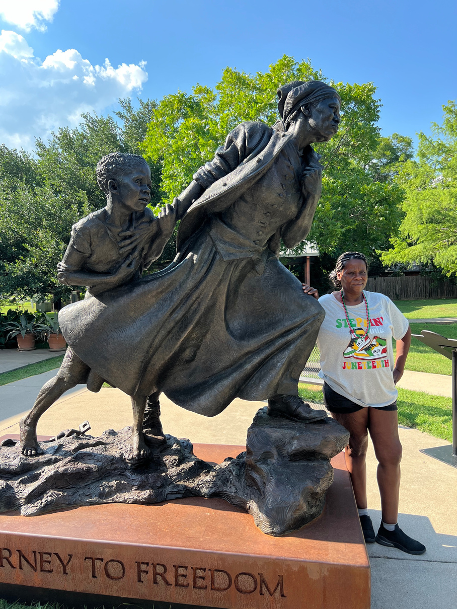 Person in front of Harriet Tubman statue