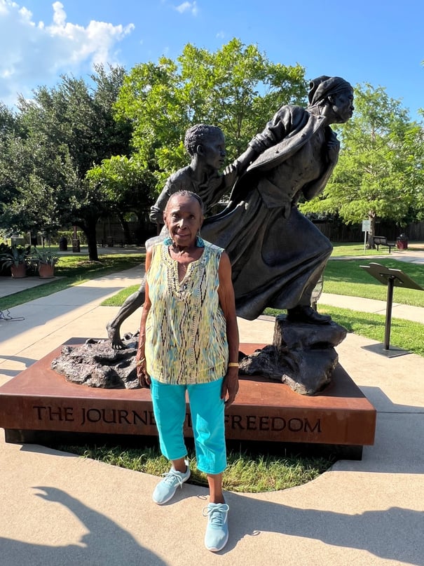 Person in front of Harriet Tubman statue