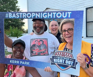 The third photo is of people at the Bastrop Night Out at Kerr Park